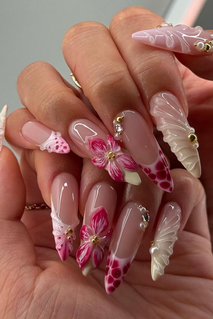 Pink 3D floral stiletto nails with pearls and gold beads